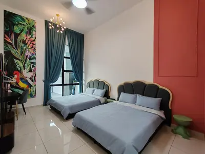 a bedroom with two beds and a painting on the wall at Starhill Lake Retreat in Lahat