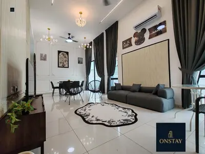 a living room with a couch and a table at Starhill Lake Retreat in Lahat
