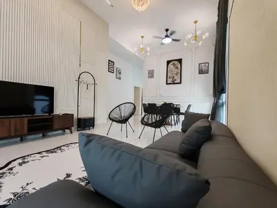 a living room with a couch and a television at Starhill Lake Retreat in Lahat