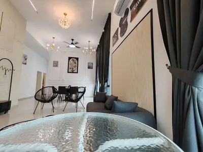 a living room with a couch and a table at Starhill Lake Retreat in Lahat