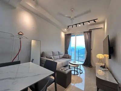 a living room with a couch and a table at ICC Premium Executive Suite - Ipoh in Ipoh