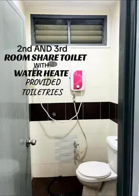 a bathroom with a toilet and words on the wall at Puteri Resident In Stay in Sungai Petani