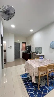 a dining room with a table and some chairs at Puteri Resident In Stay in Sungai Petani