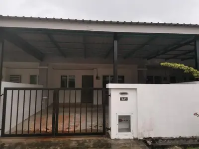 a white building with a gate in front of a house at Puteri Resident In Stay in Sungai Petani