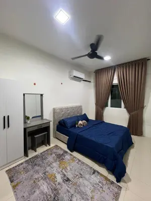 a bedroom with a bed and a ceiling fan at Puteri Resident In Stay in Sungai Petani