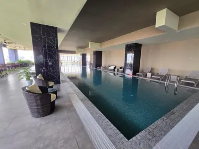 a large swimming pool in a hotel room at ICC Ipoh Bond Suites by Merveille Louise in Ipoh