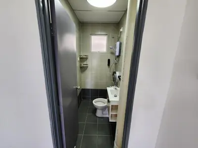 a small bathroom with a toilet and a sink at Cameron Highland 910 The Garden 3BR 6 Pax in Brinchang