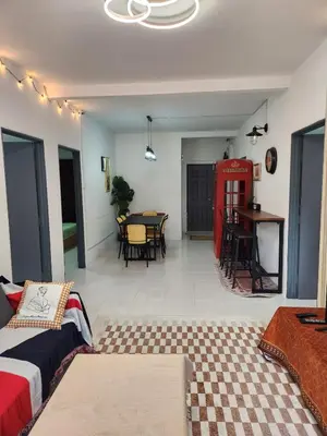 a living room with a couch and a table at Cameron Highland 623 London style 10pax in Brinchang