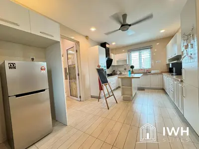 a kitchen with a refrigerator and a table in it at Botani Pool Villa 5R4B 14pax Karaoke BBq in Ipoh