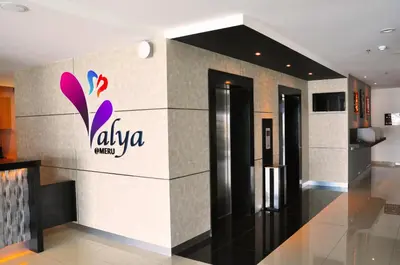 a lobby with a alaya hotel sign on the wall at Valya Hotel, Ipoh in Ipoh