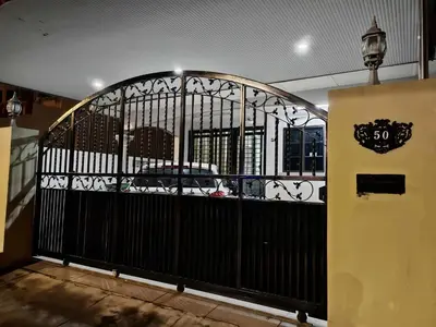an entrance to a building with a black gate at Be Stay Ipoh with parking - 14pax, 5Rooms in Ipoh