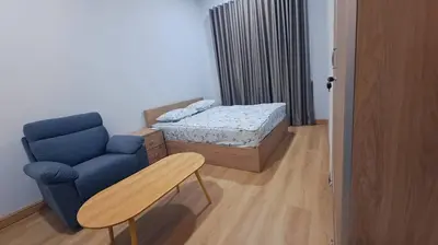 a room with a couch and a bed and a table at Tiara Homestay Bandar Baru Kuala Lipis in Kuala Lipis