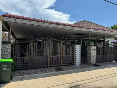 a building with a gate in front of it at Teratak Perdana in Sungai Petani
