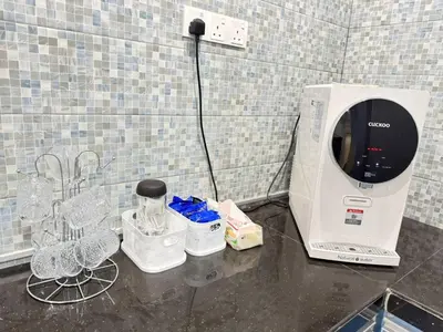 a coffee maker sitting on top of a counter at Teratak Perdana in Sungai Petani