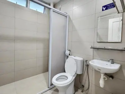 a bathroom with a toilet and a sink at Georgetown Stay in George Town
