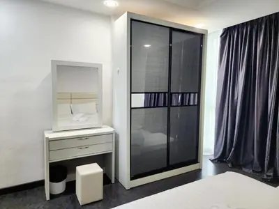a bedroom with a mirror and a white dresser with a mirror at Georgetown Stay in George Town
