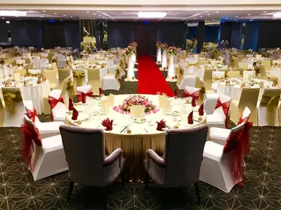 a large banquet hall with white tables and chairs at Olive Tree Hotel Penang in Bayan Lepas