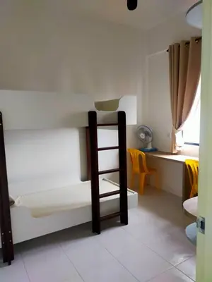 a bedroom with a bunk bed with a ladder in it at Iskandar SmartStay in Kampong Bota Road