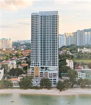 an aerial view of a tall building in a city at Penang Beachfront Seaview Residences in Tanjong Tokong