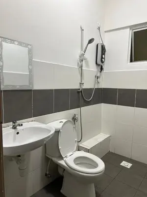 a bathroom with a toilet and a sink and a phone at StichStay Cameron in Tanah Rata