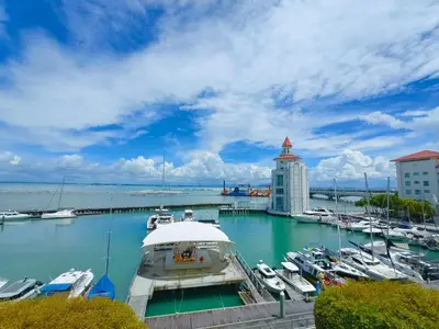a marina with boats docked in the water at Straits Quay By The Marina 1BR Family Suite in Tanjong Tokong
