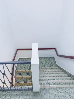 a stair case with a white light on it at Tanjung Bungah Holiday Home 4BR 20Pax 6Carpark in Tanjung Bungah