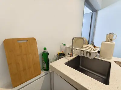 a kitchen counter with a sink and a window at Tanjung Bungah Holiday Home 4BR 20Pax 6Carpark in Tanjung Bungah