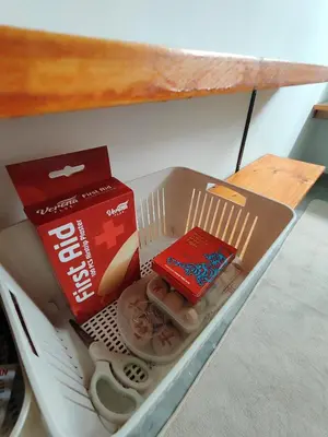 a drawer with a box of food and a book at Sunny Nest in Gopeng