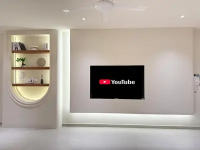 a white wall with a youtube sign on it at Taiping Corner Homestay in Taiping