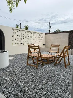 two wooden benches sitting on top of a patio at Taiping Corner Homestay in Taiping