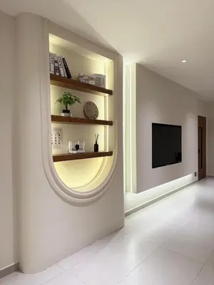 a room with a round window and a tv on a wall at Taiping Corner Homestay in Taiping