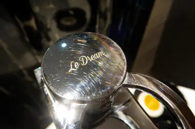 a close up of a spoon with an egg on it at Le Dream Boutique Hotel in George Town