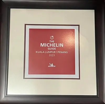 a framed picture of the mitzlin club of kovalimimimim at Le Dream Boutique Hotel in George Town