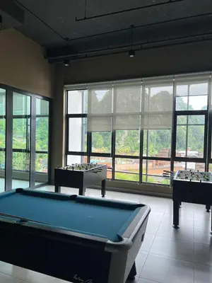two pool tables in a room with windows at Sunway Onsen beautiful view 4-6pax in Tambun
