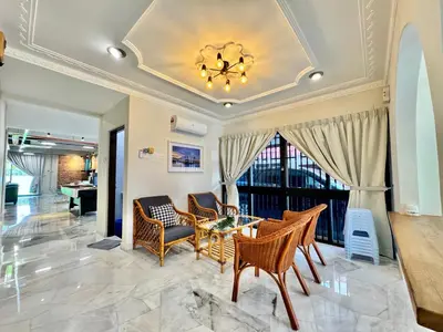 a living room with a coffered ceiling and a table and chairs at Ruyu 44 TownVilla 5R4B 18pax Bbq KTV Pool Table in Ipoh