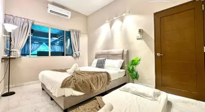 a bedroom with two beds and a window at Ruyu 44 TownVilla 5R4B 18pax Bbq KTV Pool Table in Ipoh