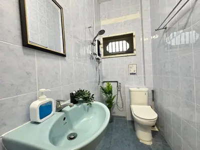 a bathroom with a sink and a toilet at Ruyu 44 TownVilla 5R4B 18pax Bbq KTV Pool Table in Ipoh