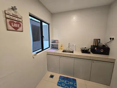 a kitchen with a counter and a sink and a window at Manhattan Condo - Ipoh Merveille Luxe Stay in Ipoh
