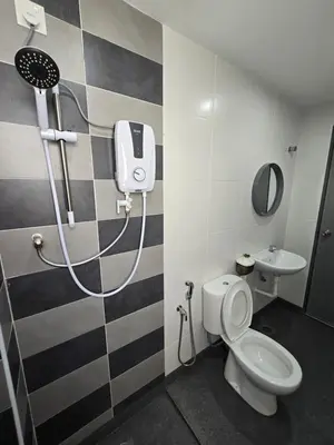 a bathroom with a shower and a toilet and a sink at Manhattan Condo - Ipoh Merveille Luxe Stay in Ipoh