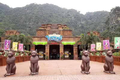 a group of statues of cats in front of a building at EcoPutra Stay in Ipoh
