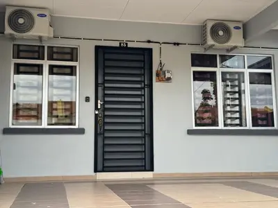 a black door on a white wall with two windows at Sour'd Staycation Near Teluk Senangin Beach in Kampong Batu Tiga
