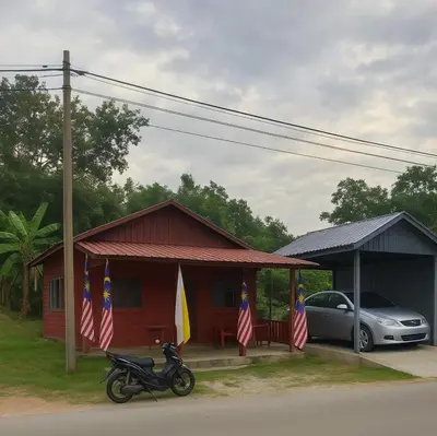 a motorcycle parked in front of a house with flags at Teratak Desa Cemerlang 3 in Kuala Kangsar