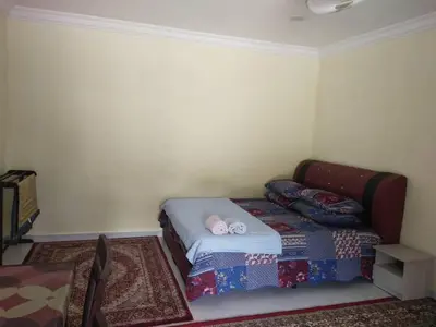 a small bedroom with a bed in a room at Teratak Desa Cemerlang 3 in Kuala Kangsar