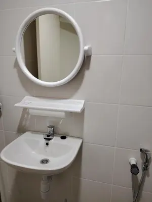 a bathroom with a sink and a mirror on the wall at CK Homestay in Ipoh
