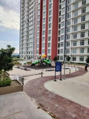 a playground in front of a large building at CK Homestay in Ipoh