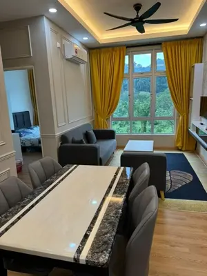 a living room with a table and a couch at Ipoh Anderson Residence in Ipoh