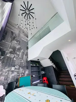a dining room with a view of a city at AYAAN Foosball Penthouse at Golden Hill with Private Parking and Netflix in Brinchang