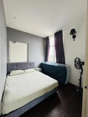 a bedroom with a white bed and a window at AYAAN Foosball Penthouse at Golden Hill with Private Parking and Netflix in Brinchang