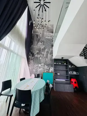 a dining room with a table and a city mural at AYAAN Foosball Penthouse at Golden Hill with Private Parking and Netflix in Brinchang