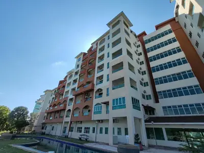 an apartment building with a pool in front of it at KIMNA HOME at MARINA HEIGHT in Lumut